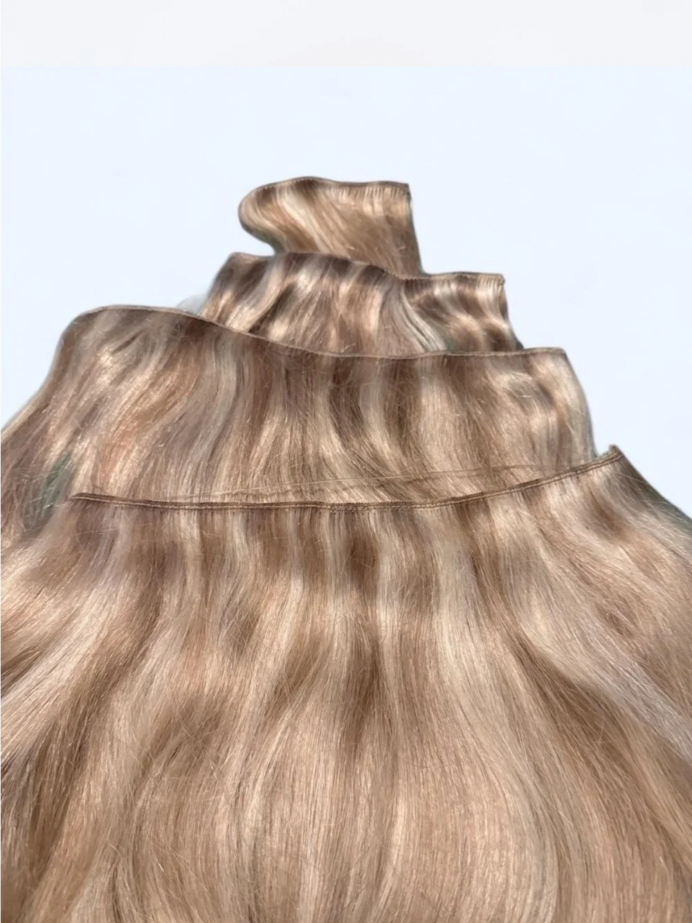 Blonde Wavy Clip-In Extensions with Subtle Ombré Effect